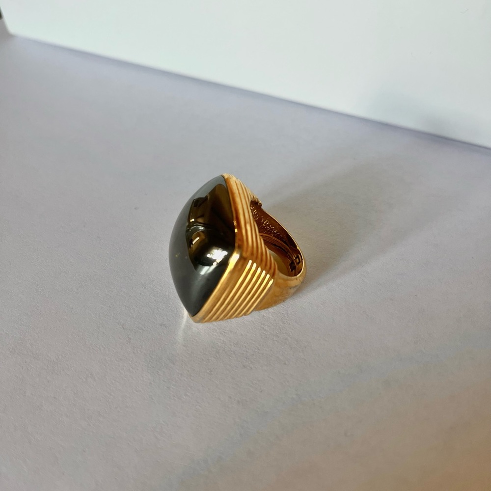 Green stone and gold tone cocktail ring, flexible sizing.